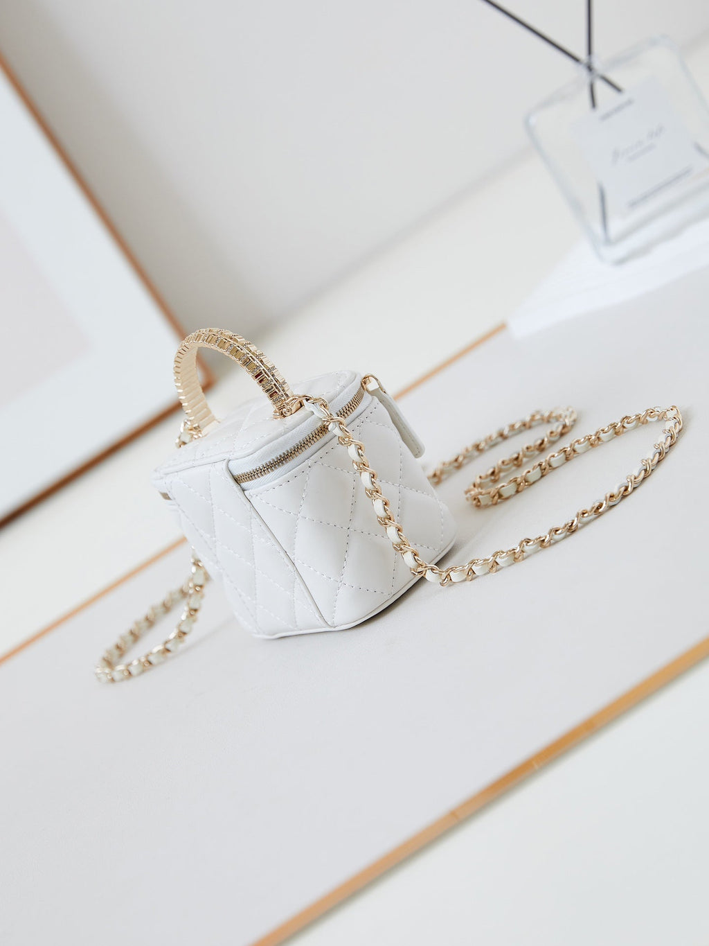 Chanel 25S Mini Vanity Bag 11 cm in White Lambskin with Crystal-Embellished Logo