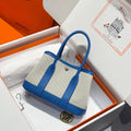 Hermes Garden Party 23cm in White Mix Black Toilets Cotton Canvas and Blue Calfskin Bag