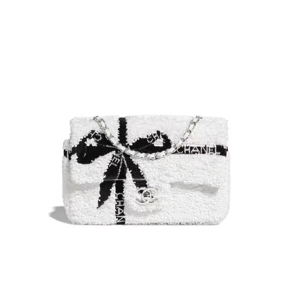 Chanel 25S Flap Bag 20 cm in White Sequins with Black Bow