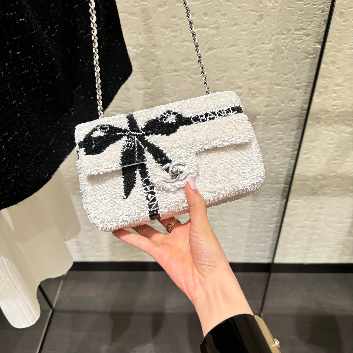 Chanel 25S Flap Bag 20 cm in White Sequins with Black Bow